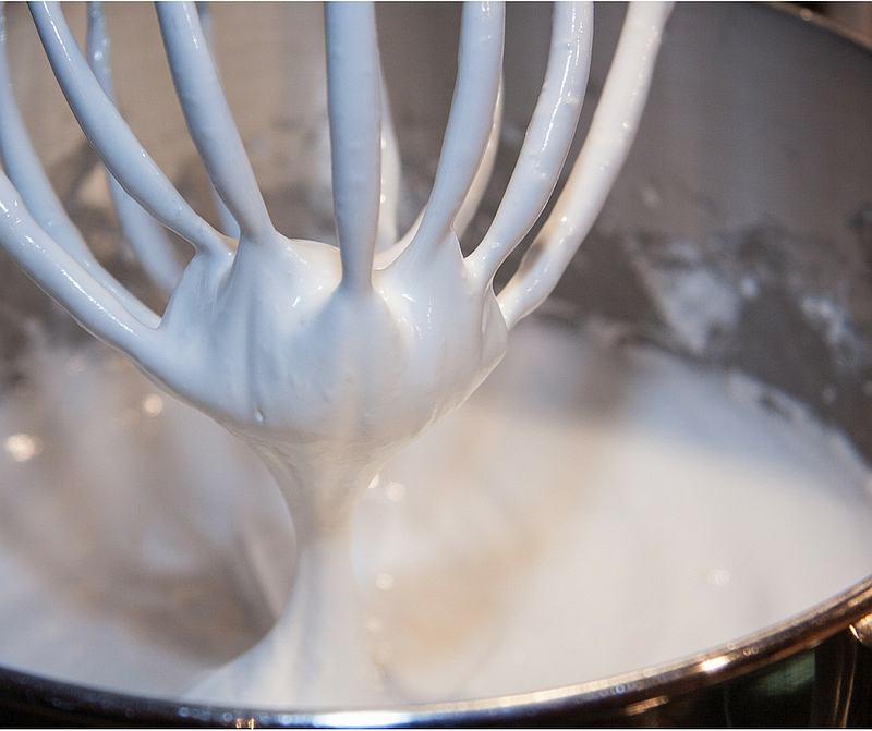 Whipped cream in mixing bowl